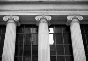 Stock photo of three pillars holding a building