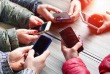 Group of People Holding Phones